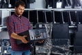 Computer technician engineer holding a broken personal computer.
