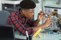 computer technician examining cables in pc