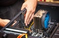 Computer technician installs cooling system