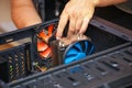 Computer technician installs cooling system of computer.