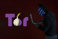 Computer with the tor logo. Tor is the acronym Royalty Free Stock Photo