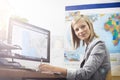 Computer, travel agent portrait and happy woman writing, planning or research destination, online service, tourism Royalty Free Stock Photo