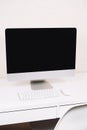 Computer on white desktop, office space Royalty Free Stock Photo
