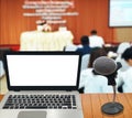 Computer with white screen on table with blur background. Technology concept