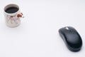 Computer wireless mouse, cup of coffee, Jack Russel dog side of coffee cup Royalty Free Stock Photo