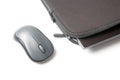 Computer wireless mouse next to a laptop on a white table close-up. electronic personal industry Royalty Free Stock Photo
