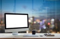 Computer on work table and city night background Royalty Free Stock Photo