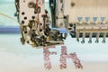 Computerized embroidery machines. sewing machine on blurred background. textile workshop. closeup