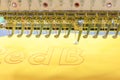 Computerized embroidery machines. sewing machine on blurred background. textile workshop. closeup