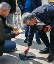 Con artists performing Shell Game scam to suspecting victims using matchsticks and small paper ball. The aim of the game Royalty Free Stock Photo