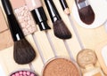 Concealer, primer, foundation, powder, blush with make-up brush Royalty Free Stock Photo