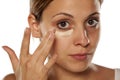 Concealer under her eyes Royalty Free Stock Photo