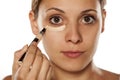 Concealer under her eyes Royalty Free Stock Photo