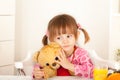 Conceived little girl hugging a teddy bear Royalty Free Stock Photo