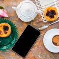 Conceived with the morning coffee and cakes Pasteis de nata, typical pastry from Portugal on natural marble surface. Royalty Free Stock Photo