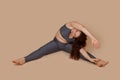 Concentrate curly haired, barefoot woman corpulency doing sports gymnastics incline with arms to right. Self acceptance Royalty Free Stock Photo