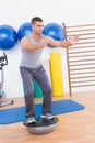 Concentrate man training in bosu ball Royalty Free Stock Photo