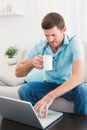 Concentrate man using his laptop at home Royalty Free Stock Photo