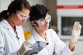 Concentrate science students looking at Petri dish Royalty Free Stock Photo