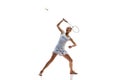 Concentrate young woman, badminton athlete in motion playing isolated over white background. Winning game