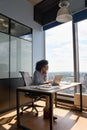 Concentrated African American businesswoman working typing using pc laptop.