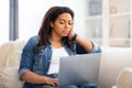 Concentrated african american woman working on laptop