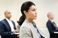 Concentrated Asian businesswoman listening to business seminar Royalty Free Stock Photo