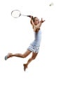 Concentrated athlete in motion, young girl, badminton player hitting shuttlecock in jump isolated over white background Royalty Free Stock Photo