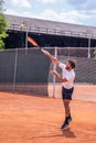 Concentrated athletic equipment man tennis player training for the championship he playing outdoor the tennis game on