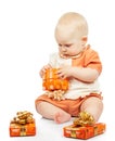 Concentrated baby develops christmas gift Royalty Free Stock Photo