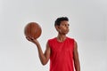 Concentrated black boy basketball player hold ball