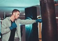 Concentrated boxer direct hit with punching bag