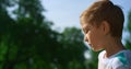 Concentrated boy play football closeup. Active kid training soccer uotdoors. Royalty Free Stock Photo