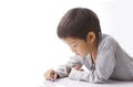 Concentrated boy plays dices on table