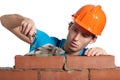 Concentrated bricklayer putting