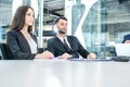 Concentrated business people listening to a presentation at a business seminar. Royalty Free Stock Photo