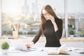 Concentrated businesslady working in office