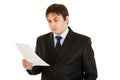 Concentrated businessman checking document