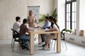 Confident businesswoman make flip chart presentation at meeting Royalty Free Stock Photo