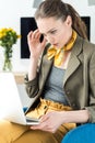 concentrated businesswoman using laptop while sitting Royalty Free Stock Photo