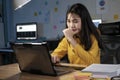 Young woman working on laptop in the office. Royalty Free Stock Photo