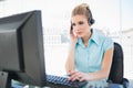Concentrated call centre agent working on computer Royalty Free Stock Photo