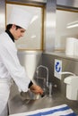 Concentrated chef washing hands Royalty Free Stock Photo