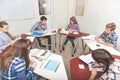 Concentrated children sitting in circle