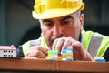 Construction worker using colourful toy bricks