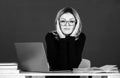 Concentrated college teacher on the chalkboard. Young caucasian female teacher portrait with blackboard background. Royalty Free Stock Photo