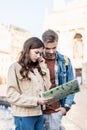 And concentrated couple with map in