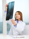 Concentrated doctor looking at x-ray Royalty Free Stock Photo