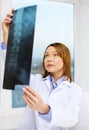 Concentrated doctor looking at x-ray Royalty Free Stock Photo