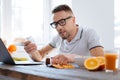 Concentrated earnest man taking biohacking supplements